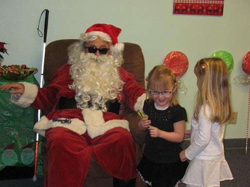 Blind Santa and two little girls